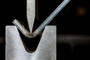 working with sheet metal on CNC hydraulic press brake. Bending sheet metal