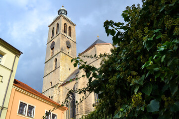 Fototapeta na wymiar The Church of St James (Jacob) catholic church building with clock tower in Kutna Hora historical Town Center, Central Bohemian Region, Czech Republic.
