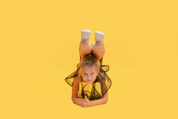 Young beautiful gymnast in sportswear performs a handstand. Workout, gymnastics element. Sports...