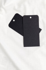 black tags on cotton material