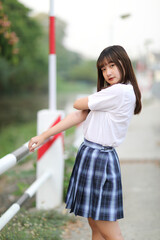 beautiful asian japanese school girl uniform looking at park outdoor
