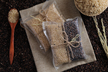 Organic raw brown rice and riceberry rice in close up