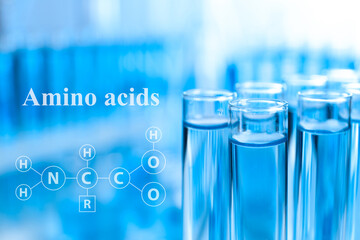 Amino Acids chemical formula, illustration. Test tubes with liquid samples for analysis in laboratory, closeup