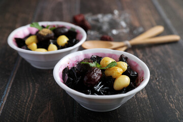 Local Thai dessert glass jelly isolated in wood background