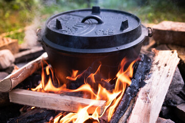 Dutch oven cooking on a campfire