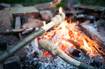 Stick bread around the campfire