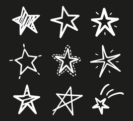 Hand drawn outline stars on isolated background. Freehand simple signs. Quick sketches. Black and white illustration