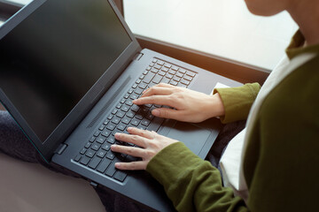 Closeup man working remotely at home, Man typing on laptop or computer