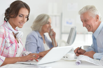 Fototapeta premium Portrait of businesspeople working in modern light office