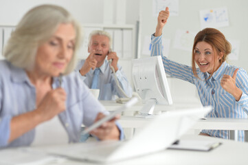 Obraz premium Portrait of businesspeople working in modern light office