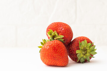 Ripe red strawberries on a white background