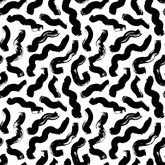 Fototapeta na wymiar Hand drawn wavy and swirled brush strokes. Monochrome vector seamless pattern. Black paint doodle scribbles, curled lines, swooshes and flourishes. Abstract ink background, wallpaper design, textile
