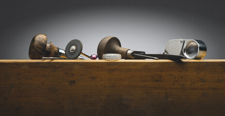 Diamonds golden ring, gem stone, jeweller tools and equipments for jewelry work on an antique...