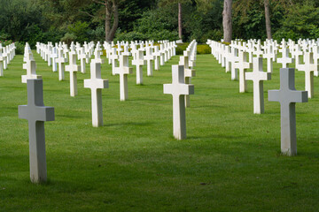 Fototapeta na wymiar Colleville-Sur-Mer, France - 08 03 2021: Normandy American Cemetery and Memorial and the white crosses