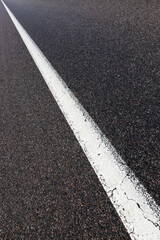 Fototapeta premium paved road with white road markings