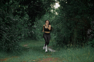Young people trail running Exercising on forest path. Healthy, fitness, wellness lifestyle. Sport, cardio, workout concept