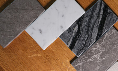View of color samples marble  on oak wood table.