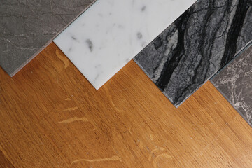 View of color samples marble  on oak wood table.