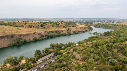 Fototapeta na wymiar Quarry filled with water, artificial lake, recreation and swimming area, aerial view