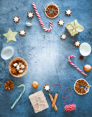 Christmas edible background frame flat lay copy space.Christmas composition of lollipops cane,...