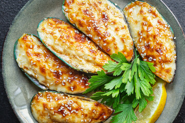 mussels baked with cheese seafood cream sauce outdoor meal snack on the table copy space food background rustic. top view keto or paleo diet vegetarian food pescetarian diet