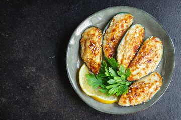 mussels baked with cheese seafood cream sauce outdoor meal snack on the table copy space food background rustic. top view keto or paleo diet vegetarian food pescetarian diet