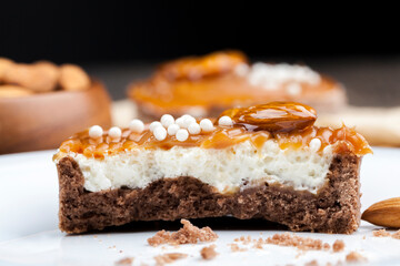 tartlet with milk cheese filling and lots of salted caramel with nuts