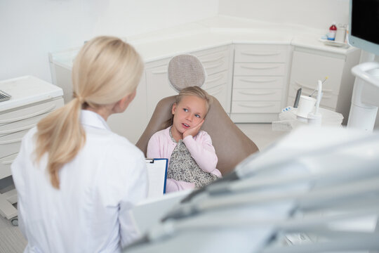 Pediadontist working with a snall patient in the clinic