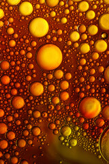 oil bubbles with water on glass