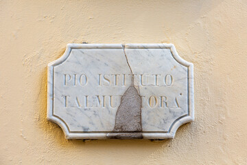 Stone with text on the wall of Synagogue in Rome
