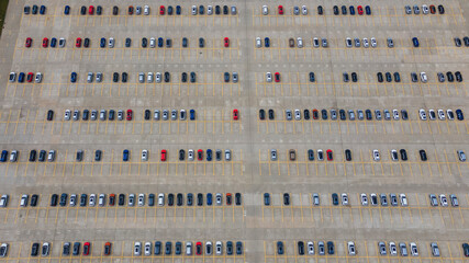 Aerial view new car lined up in the street parking of automobile plant for sale. Automobile and automotive car parking lot for commercial business industry. Industry concept.