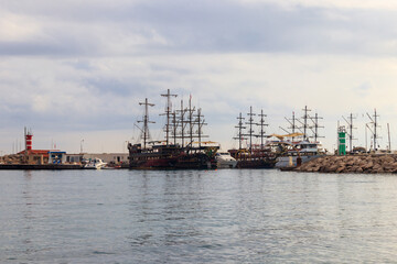 Stylized pirate yachts in marina harbor in Kemer, Turkey