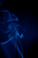Obraz premium Blue smoke on black background.