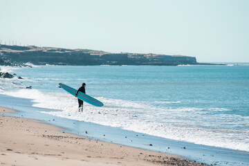 surfing on the beach	
