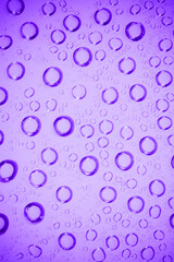 Water bubble on .purple glass.