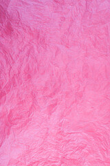 Crumpled vintage red paper textured obsolete background.