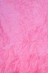 Crumpled vintage red paper textured obsolete background.