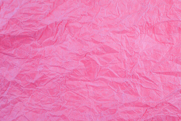 Crumpled vintage red paper textured obsolete background.