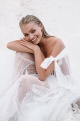 Beautiful wedding bride day outdoors at ocean beach. Happy marriage couple o