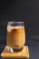 Iced coffee with milk in a glass or iced cappuccino.