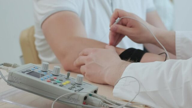 Patient nerves testing using electromyography at medical center