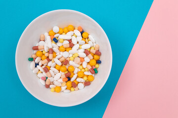 Global Pharmaceutical Industry and Medicinal Products - Colored Pills and Capsules in White Dish on...