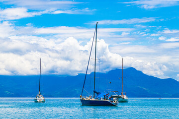 Boats ships and Boat trips Abraao beach Ilha Grande Brazil.