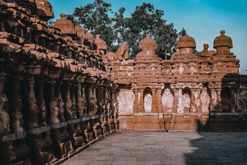 Fototapeta premium Beautiful Pallava architecture and exclusive sculptures at The Kanchipuram Kailasanathar temple, Oldest Hindu temple in Kanchipuram, Tamil Nadu - One of the best archeological sites in South India
