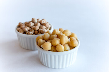 Chickpeas, healthy food Raw, cooked and fried chickpeas on white background.