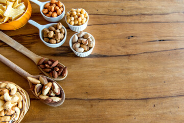 Healthy snack, beans, cassava chips, pistachios, Brazil nuts, chickpeas, peanuts and almonds.