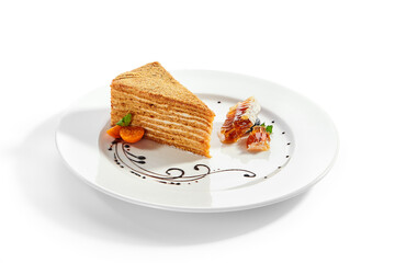 Medovik slice in white plate
