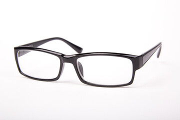 Stylish glasses with black frames on a white background