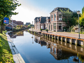 Wargaastervaart canal in village of Warga in Leeuwarden, Friesland, Netherlands