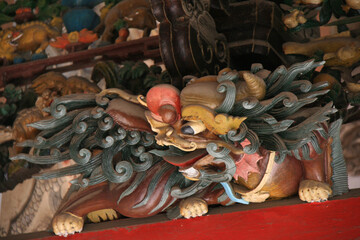 sculpted dragon at a chinese pavilion in hoi an in vietnam